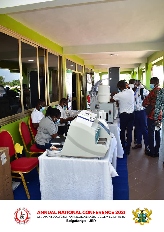 Reviewing laboratory equipment on the exhibition floor.